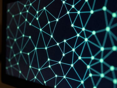 Abstract geometric data visualization on a screen, glowing cyan and mint green nodes and connections, dark background, technical minimalist aesthetic, macro lens