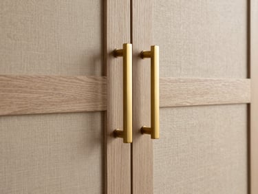 Close-up detail of custom oak joinery, brushed brass handles, textured linen fabric, soft diffused warm lighting, architectural minimalism, 35mm lens.