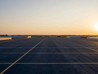 Wide panoramic view of strategic industrial land plot, clean horizon, sunset lighting, professional real estate photography.