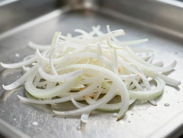 Macro photography of white dehydrated onion flakes on a clean stainless steel surface, bright industrial lighting, crisp details emphasizing purity.