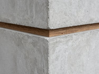 Close-up texture detail of raw board-formed concrete meeting a dark oak wood joint, soft natural side lighting