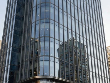 Sleek commercial office building exterior in Dubai, reflective glass facade, clean geometric lines.