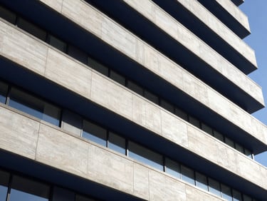 Abstract financial lines, architectural details, modern corporate setting, natural light, deep navy and neutral tones, sharp focus, 35mm