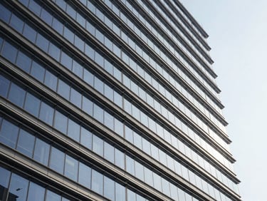 Modern corporate architecture, abstract financial lines, bright natural daylight, deep navy and neutral tones, sharp focus, 35mm