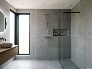 Straight-on architectural shot of a modern bathroom with large format grey tiles, crisp white grout lines, bright natural daylight from a side window, highly detailed.