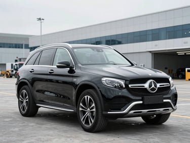 Black Mercedes-Benz luxury SUV staged in a clean modern port terminal, bright overcast daylight, cool metallic tones