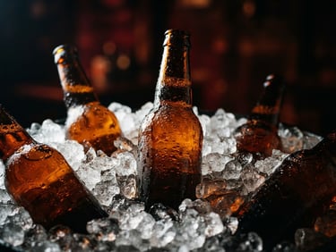 Close-up of condensation-covered amber beer bottles packed in crushed ice, dramatic backlighting, dark moody background, high-contrast premium food photography, 50mm lens