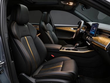 Flawless customized car interior with premium black leather seats, gold stitching, glowing ambient lighting, and a sleek Android touchscreen display