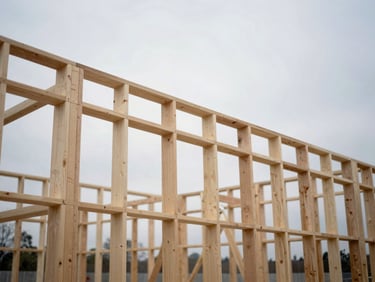 Close-up of mass-timber construction framework, crisp overcast daylight, desaturated cool tones, wide-angle tilt-shift lens, 35mm