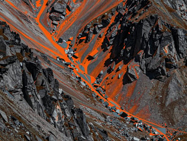 Abstract 3D point cloud of a rugged mountain pass in the Pyrenees, rendered in high-contrast orange and slate gray dots, showcasing laser-grammetry precision