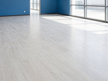 Wide corporate office floor with dull, scuffed linoleum tiles before specialized treatment, bright daylight, architectural perspective