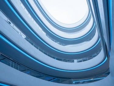Abstract financial data visualization with glowing blue lines and clean architectural curves, 50mm, cool blue tones