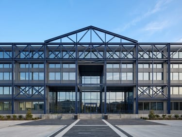 Symmetrical architectural shot of a modern clean framed building structure, crisp natural daylight, navy steel beams, 35mm lens