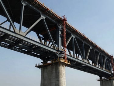 Wide-angle shot of a massive steel-reinforced bridge structure under construction, dramatic low horizon, harsh daylight highlighting steel joins.