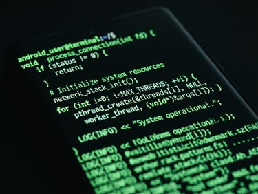 Extreme close-up macro shot of a high-end Android hardware screen displaying a terminal interface with green monospaced code, dark studio lighting, moody ambient screen glow, neon green accents, 35mm