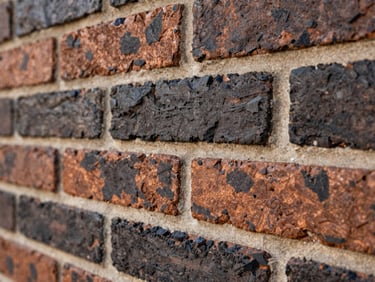 Macro shot of historic brickwork with new, perfectly matched mortar joints, warm natural light highlighting texture, 35mm