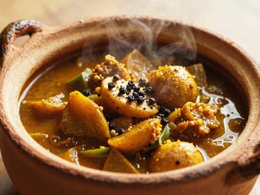 Slow-simmered Malabar vegetable stew in a traditional clay pot, steam rising, garnished with freshly cracked black pepper, warm side-lighting, 35mm film