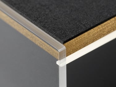 Macro close-up of a translucent acrylic sheet edge, light refracting through the polished golden-tinted material, high-contrast structural lines, 35mm
