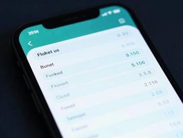 Macro shot of a smartphone screen displaying a clean, modern AI chat interface with structured financial output, showing a detailed budget breakdown. Teal and navy tones, cool digital ambient light.