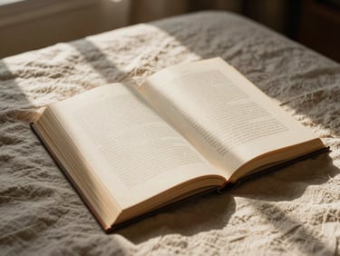 Open book on a linen sheet, soft morning window light, warm shadows, tactile and organic feel.