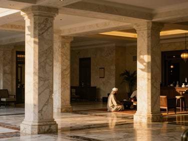 Luxury hotel lobby in Medina, elegant marble columns, soft warm lighting, peaceful atmosphere, 35mm editorial photography