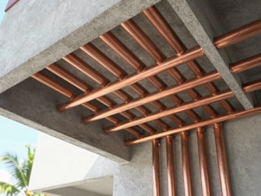 Technical macro detail of neatly aligned copper pipes and electrical conduits inside a modern utility room, technical-editorial style