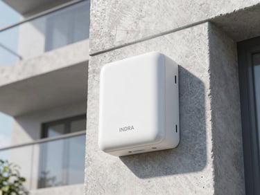 Close-up of a sleek white INDRA energy unit mounted on a modern concrete apartment balcony wall, soft morning sunlight, architectural detail, 35mm