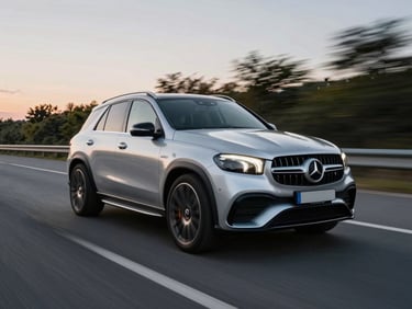 Dynamic tracking shot of a silver Mercedes GLE 63S AMG on a modern highway, motion blur, dusk.