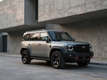Rugged yet modern Jetour T2 parked in front of minimalist concrete architecture, low-key lighting.