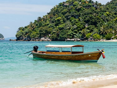 A traditional wooden boat cruising past lush green islands in Nha Trang bay, crystal clear turquoise water, sunny day