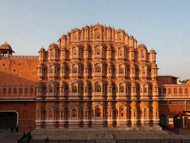 A majestic view of a Rajasthani palace courtyard in Jaipur during golden hour, intricate arches, warm natural sunlight, 35mm lens.