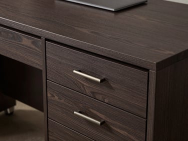 Premium executive desk in dark veneer finish with brushed metal wire grommets and sleek drawer handles.