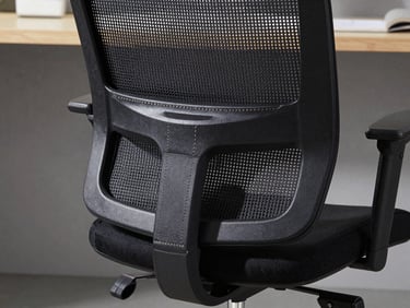 Macro shot of double-stitched mesh backrest and adjustable lumbar support mechanics on an office chair.