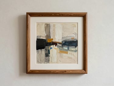 A custom-framed abstract artwork hanging on a textured off-white plaster wall, elegant wooden frame, soft shadows.