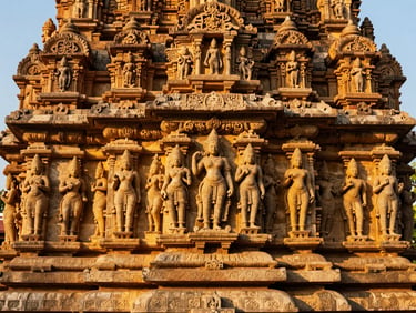 Close-up of a detailed stone carving on the Konark Sun Temple, Odisha, golden hour sunlight, rich saturated earth tones, warm editorial travel photography.
