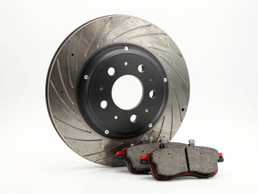 Studio product photography of a genuine Honda metallic brake disc and brake pads, pristine white background, high-contrast lighting