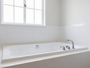 Immaculate white walk-in tub with chrome fixtures, clean white tile surround, bright neutral daylight