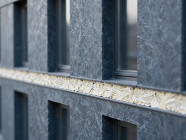 Cross-section detail of a sustainable building facade, showing insulation layers and material textures, sharp focus, technical drawing style, soft northern daylight