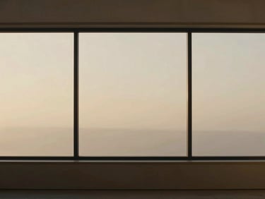 Minimalist interior with a subtle digital overlay on a large window, warm golden-hour light, wide cinematic frame.