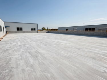 Clean, newly laid industrial-grade flooring in a building's common area, bright natural daylight, professional architectural photography, sharp focus