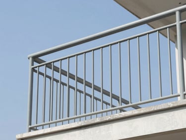 Close-up of a newly installed metal railing on a building balcony, modern design, professional architectural photography, sharp focus