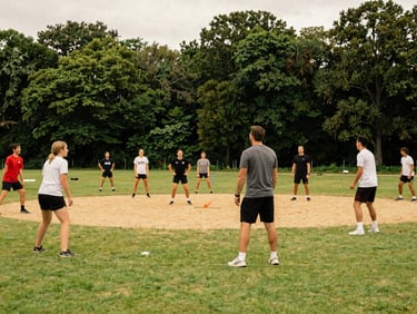 Adaptive outdoor sports event with diverse participants playing on a green field, coaches smiling, warm editorial photography, 35mm.