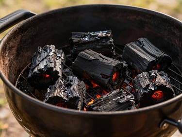 Tight shot of glowing charcoal in a Weber Kettle Premium grill, ready for indirect cooking, natural outdoor daylight, shallow depth of field, 35mm