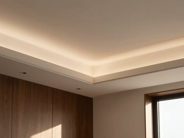 Close-up of a modern false ceiling with integrated recessed lighting, showcasing clean lines and subtle shadow play.