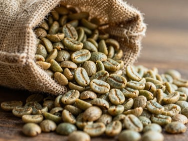Close-up of premium green coffee beans and freshly roasted specialty beans spilling from a burlap sack, golden hour side-light.
