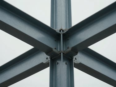 Extreme close-up of a structural steel and glass mullion intersection, diffused overcast daylight, technical focus