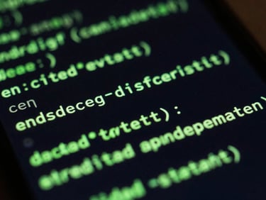 Extreme close-up macro shot of a physical Android screen displaying crisp, neon green code terminal lines, dark ambient lighting, high contrast, 35mm