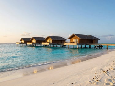 Overwater bungalow on a pristine private atoll, turquoise water, empty beach at dawn, soft natural light, wide environmental shot.