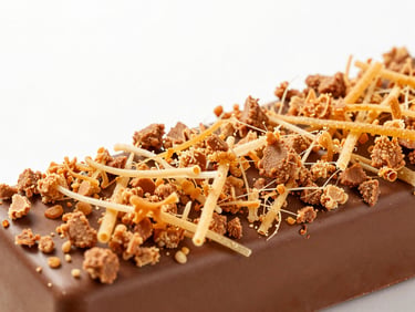Close-up of viral Kunafa chocolate bar with crunchy kunafa strands, vibrant packaging, studio lighting, sharp focus, on a clean modern backdrop.