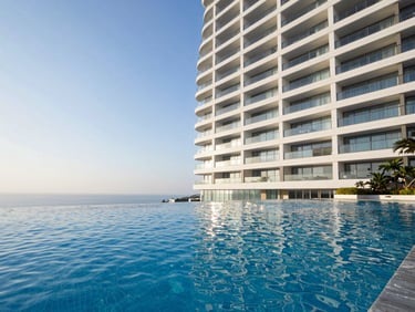 Crisp architectural photography of a luxury hotel infinity pool at sunset, crystal clear water, sharp focus
